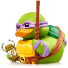 a toy turtle with a hat on it's head and holding a stick in its hand