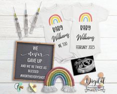 two personalized onesuits, one with a rainbow and the other with a baby's name