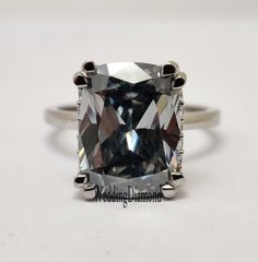 an engagement ring with a cushion cut diamond