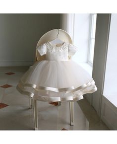 Shop high-end beaded ivory puffy flower girl dress pageant gown with sleeves online. Super cute styles with couture high quality. Pro since 2009. Baby Girl Christening Dresses, Gown With Sleeves, Elegant Girls, Toddler Party Dress, Pageant Gown, Baby Party Dress, Beaded Tulle, Baptism Dress