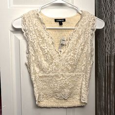 Lace V-Neck Blouse. Off-White And Unworn. Chic White V-neck Crop Top, White V-neck Crop Top For Spring, Chic V-neck Lace Crop Top, White V-neck Lace Top, White Lace V-neck Top, Elegant White Lace V-neck Top, White V-neck Blouse With Lace Top, White Feminine V-neck Crop Top, White Fitted Lace Top With V-neck