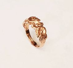 You are looking at a beautiful Hand carved 14 carat rose gold flower and leaves ring. I pay close attention to detail. Can be ordered in sizes 5 to 9. Can also be ordered in yellow gold white gold rose gold and platinum email for Details. I'm Ernesto and Award-winning designer Rose Gold Hallmarked Flower Ring For Wedding, Formal Yellow Gold Flower Ring With Rose Design, Rose Gold Flower Ring With Rose Design, Hallmarked 14k Rose Gold Flower Ring, Formal Rose Gold Rings With Rose Design, 14k Yellow Gold Flower Ring With Rose Design, Ring With Leaves, Rose Gold Flower Ring, Leaves Ring