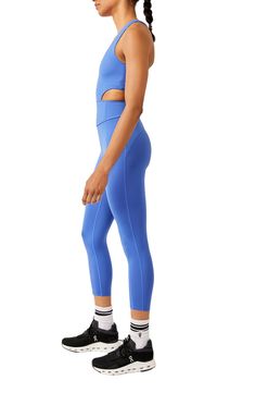 Make a run for it in this cardio-ready jumpsuit cut from a stretchy, buttery-soft knit with a bold, strappy back and the light support of a built-in shelf bra. 23" inseam; 9" leg opening (size Medium) Scoop neck Built-in shelf bra 80% polyester, 20% elastane Machine wash, tumble dry Imported Stretch Elastane Unitard For Sports, Sports Stretch Elastane Unitard, Compressive Elastane Unitard For Sports, Athleisure Elastane Unitard For Pilates, Sporty Solid Color Unitard, Solid Color Sporty Elastane Unitard, Fitted Moisture-wicking Jumpsuits And Rompers, Spring Stretch Jumpsuits And Rompers For Yoga, Spring Yoga Stretch Jumpsuits And Rompers