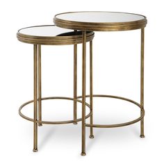 two tables with glass tops and gold metal frames, one on each side by the other