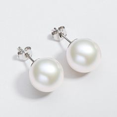 Product Information



SKU:
FWPE-052


Metal:
925 Sterling Silver


Rhodium:
Yes 


Nickle Free:
Yes


Gem Type:
Pearl


Pearl Information



Pearl Type:
Freshwater Pearl


Pearl Color:
White



Number of pearls:
2


Shape:
Round 



Pearl Size :
11mm


Surface markings:
Clean


Blemishes:
Clean


Uniformity:
Very-good


Luster:
High luster Pearl Types, Pearl Stud Earrings, Pearl Color, Pearl Size, Pearl Studs, Freshwater Pearls, Pearl Earrings, Color White, Gems