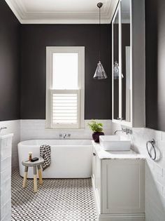 the bathroom is decorated in black and white