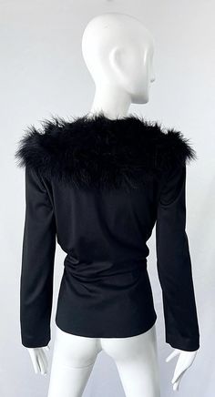 For Sale on 1stDibs - Chic early 70s LILLI DIAMOND black jersey marabou feather encrusted long sleeve cardigan top ! Features a tailored fit with buttons up the front center. Long Sleeve Feather Outerwear For Fall, Long Sleeve Feather Top For Fall, Long Sleeve Feathered Outerwear For Fall, Long Sleeve Feathered Tops For Fall, Chic Feathered Tops For Fall, Chic Long Sleeve Feathered Outerwear, V-neck Winter Evening Outerwear, Long Sleeve Tops With Feather Trim For Fall, Chic Long Sleeve Cardigan With Faux Fur Trim