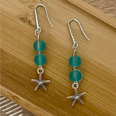 New Pretty Frosted Aqua Blue Bead Starfish Earrings With 925 Silver Ear Wire Hooks. Earrings Are 2 1/4 Inches Long Handmade Green Starfish Jewelry, Handmade Green Starfish-shaped Jewelry, Elegant Blue Jewelry With Starfish Charm, Elegant Blue Starfish Charm Jewelry, Blue Star-shaped Sterling Silver Earrings, Blue Sterling Silver Star Earrings, Blue Starfish Charm Earrings For Gift, Silver Star-shaped Beaded Earrings, Ocean-inspired Sterling Silver Jewelry With Ear Wire