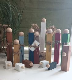 a group of wooden pegs sitting next to each other on a white counter top