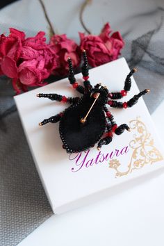 "Ruby Red Spider brooch it is embroidered brooch by gemstone and crystal. This insect jewelry is the best Halloween gift. Spider jewelry has a size 2.4*2.8 inches (6*7 cm). Video of this item you can see here https://youtu.be/4aDNPdXYIjU Beaded spider brooch, designer's jewelry inspired by Nature - insect brooch Spider with Czech crystal beads. It will perfectly complement your unique jewelry collection or will be a wonderful gift as a Halloween brooch. Looks very elegant! A Spider jewelry brooc Halloween Brooch Jewelry Gift, Halloween Gift Jewelry Brooch, Handmade Black Brooches As Gift, Handmade Brooches For Halloween Gift, Halloween Brooch, Beaded Bugs, Spider Brooch, Insect Brooch, Spider Jewelry