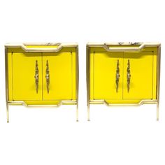 a pair of yellow sideboards with metal handles and knobs on the doors are shown in front of a white background