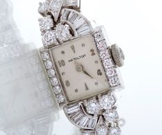 "This gorgeous vintage 1940's Hamilton watch showcases a lively display of a varying diamond cuts in a swirly pattern surrounding the dial and then all around the bracelet band. A total of 3.11 carats of smashing vintage beauty! Created in both platinum and 14k white gold. This special watch is ready for its second debut with you! Vintage Watch - Vintage Platinum & 14k White Gold 3.11ctw Diamond Ladies Watch 1940's Platinum & 14k White Gold 8 Baguette Diamonds =.40ct 34 Round Brilliant D Swirly Pattern, Antique Wedding Bands, Hamilton Watch, Watch Jewelry, Rosecut Diamond Ring, Antique Watches, Watch Vintage, Baguette Diamonds, Antique Engagement