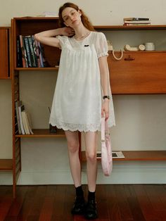 This product, the Cest Baby Doll Lace Dress, embodies a sweet and youthful charm with its delicate lace detailing. The flowy and loose fit provides both comfort and a whimsical aesthetic, perfect for a casual day out or a special occasion. The intricate lace design adds an element of sophistication to this playful dress. - This dress features a baby doll silhouette, offering a relaxed and airy fit.- The lace detailing throughout the dress enhances its delicate and feminine appeal.- Puff sleeves add a touch of vintage charm, complementing the overall design.- The scalloped lace hemline adds a refined finishing touch.- Made from soft, breathable fabric, it ensures comfort while maintaining style. Cute Summer Dress With Lace Collar, Summer Lace Mini Dress With Lace Collar, Delicate Lace Mini Dress For Daywear, Cute Summer Lace Dress, White Mini Dress With Lace Collar, Feminine Summer Lace Dress With Lace Collar, Casual Summer Dress With Lace Collar, Spring Delicate Lace Mini Dress For Daywear, Spring Mini Dress With Delicate Lace For Daywear