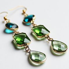 These cute hand-crafted faceted green multi-tier Crystal Earrings come in multiple designs Stone: Crystal Colour: Green Metal: Gold Plated Earring Size: 7cm Drop x 1cm Width (3 tier) or 5cm Drop x 1cm Width (2 tier) Green Metal, Rose Quartz Pendant, Stone Crystal, Green Crystal, Quartz Necklace, Quartz Pendant, Green Crystals, Gold Plated Earrings, Resin Jewelry