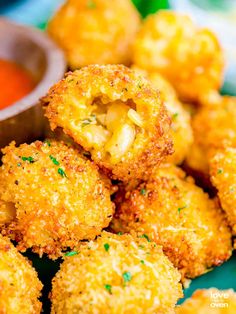 some fried food on a plate with dipping sauce