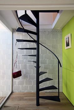 a spiral staircase in the middle of a room