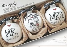 three personalized christmas ornaments in a box