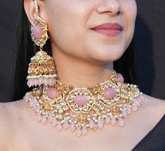 Adorn yourself with the exquisite allure of this Pink Polki Necklace Set by renowned designer Sabyasachi. Immerse in the regal beauty of Kundan Jewelry, featuring a blush pink Kundan choker adorned with intricate Jadau work. This bridal jewelry ensemble showcases the timeless elegance of Polki, exuding a captivating charm that perfectly complements your special day. Indulge in opulence and grace with the enchanting Polki choker, a masterpiece of artistry and luxury. *𝐏𝐑𝐎𝐃𝐔𝐂𝐓 𝐃𝐄𝐓𝐀𝐈𝐋* Luxury Pink Kundan Bridal Necklace, India Necklace, Polki Necklace Set, Sabyasachi Jewelry, Polki Choker, Pink Jewelry Set, Kundan Jewellery Set, Sabyasachi Jewellery, Kundan Jewelry