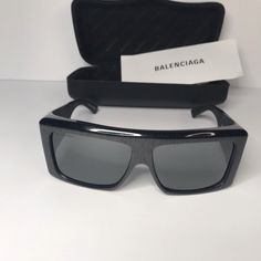 Balenciaga Black Bb0002s Shield Sunglasses A Statement Pair Of Sunglasses From Balenciaga Will Surely Make A Prized Buy. Featuring A Trendy Frame And Lenses Meant To Protect Your Eyes, The Sunglasses Are Ideal For All-Day Wear. Gender Men Includes Info Booklet, Original Dust Cloth, Original Case Origin Italy Material Acetate Hardware Gunmetal Tone Eye Size 63 Mm Temple Length 125 Mm Bridge Size 14 Mm Designer Shield Sunglasses With Tinted Lenses For Evening, Designer Shield Sunglasses With Uv Protection For Evening, Designer Anti-reflective Sunglasses For Summer, Designer Tinted Shield Sunglasses For Evening, Designer Shield Sunglasses With Tinted Lenses For Formal Occasions, Designer Shield Sunglasses With Tinted Lenses For Formal Events, Luxury Black Polarized Shield Sunglasses, Designer Black Shield Sunglasses With Uva Protection, Designer Shield Sunglasses For Summer