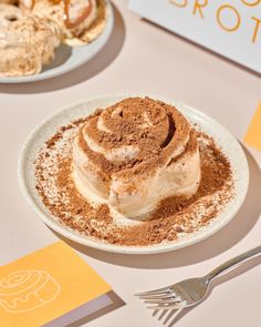 there is a dessert on the plate with powdered sugar and cinnamon sprinkles