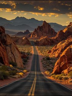 an empty road in the middle of desert with mountains in the background and clouds in the sky