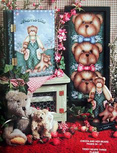 two teddy bears sitting next to each other on a red tablecloth with pink flowers