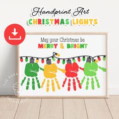 christmas lights are hung on the clothes line with handprints in green, yellow and red