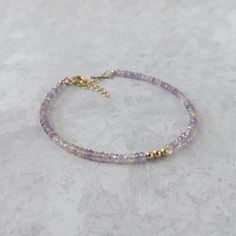 Fall in love with our dainty and sparkly ametrine gemstone beaded bracelet, perfect timeless delicate minimalist design, handmade to be stacked or worn on its own. Will make a thoughtful birthday, Christmas, or anniversary gift for your wife, mother, sister, daughter, or friend. Ametrine is a combination of Citrine and Amethyst and can be a birthstone for both February and November. Your purchase will arrive elegantly packed  in a gift-ready suede storage bag  and will include a complimentary cleaning cloth. Treat yourself or your loved ones with this high-quality handmade jewelry gift.  D E T A I L S -Genuine high-quality faceted ametrine rondel beads -Bead size approx. 3mm, the bracelet appears larger in photos  - sterling silver or 14k gold filled glittery accent beads and components -B Dainty Purple Beaded Bracelets With Round Beads, Dainty Purple Beaded Bracelet With Round Beads, Dainty Purple Beaded Bracelet, Amethyst Gemstone Beads Bracelets As Gift, Adjustable Gemstone Beaded Bracelets For Anniversary, Lavender Bracelets With Spacer Beads As Gift, Lavender Bracelets With Spacer Beads For Gift, Gold Beaded Amethyst Bracelets, Purple Rondelle Beaded Bracelets As Gift