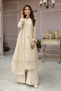 FABRIC: Chiffon Description: Embroidered Chiffon FrontEmbroidered Chiffon BackEmbroidered Chiffon SleevesEmbroidered Front + Back PatchEmbroidered Sleeves PatchEmbroidered Chiffon DupattaDyed Grip TrouserModel Size:Shirt Length : 46Trouser Length : 42 Pakistani Churidar Designs Ideas, Beige Pakistani Suit, Pakistani Kameez Designs, Trouser Shirt Pakistani Casual, Chiffon Dress Designs Pakistani, Chiffon Dress Ideas, Pakistani Sleeves Design, Pakistani Suit Designs, Chiffon Dress Design