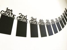 black and white paper cut out into the shape of letters that spell out, grade and grade