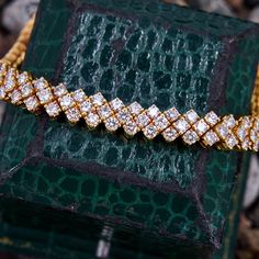 This stunning three row diamond bracelet is accented with sixty-one (61) prong set, round brilliant diamonds. The bracelet measures 6.9mm wide, 4.6mm thick and fits up to a 6.75 inch wrist. The bracelet is finished with a hidden box clasp. It is crafted in richly patinated 18k yellow gold. Thick And Fit, Box Clasp, Garnet Rings, 3 Carat, Brilliant Diamond, Round Brilliant Cut Diamond, High Quality Jewelry, Brilliant Cut Diamond, Estate Jewelry