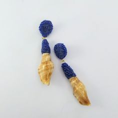 I am always in search of different styles and creating new techniques to make unique jewelry. I'm so excited to show these new unique dangle shell earrings handcrafted with high-quality glass seed beads and natural shells that I found on Portuguese beaches. After totally embroidered by hand the earrings were covered with a specific resin layer to protect and maintain the brightness. For this process, it's necessary long 7 days to dry totally. A cute and delicate piece perfect for summer days or Blue Shell-shaped Earrings For Beach, Large Beads Dangle Earrings For Beach, Beach Large Beads Dangle Earrings, Large Beaded Drop Earrings For Beach, Large Beaded Dangle Earrings For Beach, Blue Large Beads Earrings For Beach, Beaded Blue Shell, Blue Large Beaded Earrings For Beach, Blue Beaded Shell