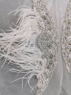 "These gorgeous bridal straps (set of 2) are made of rhinestones, frost stones, pearls, beads and ostrich feather on tulle base. SOLD AS A SET OF TWO. Dimensions: Width at centre (from top till the bottom of hanging beads) - 6 inches Width at centre (from top till the bottom of rhinestone flower) - 3.5 inches Width at edge - 1/2 inches The straps come without any hook or eye and can be stitched to the gown, but we can add hooks at each end to make detachable. Customisation in length and color av Elegant Pearl Embroidered Bridal Accessories, Elegant Bridal Accessories With Pearl Embroidery, Elegant Embellished Bridal Belt For Evening, Elegant Embellished Fitted Bridal Accessories, Elegant Pearl Embellished Wedding Dress For Party, Elegant Embellished Bridal Accessories For Mother Of The Bride, Beaded White Bridal Belt For Party, White Beaded Bridal Belt For Party, Elegant Bridal Dresses With Pearl Embroidery