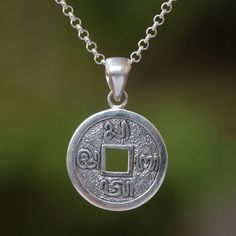 Designed by Balinese artisan Dewa Arimbawa the pendant of this necklace resembles a traditional Indonesian aksara coin. The classic coin is crafted from sterling silver featuring Indonesian characters that surround a square hole in the center. Bali Silver, Children Clothes, Domed Ring, Sterling Silver Necklace Pendants, Balinese, Contemporary Jewelry, Jewelry Packaging, Silver Pendant Necklace, Silver Diamonds