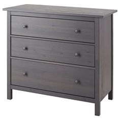 a gray dresser with three drawers and two doors on the bottom drawer, in front of a white background