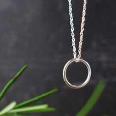 This simple silver ring necklace makes for a versatile accessory whatever the occasion. Wear alone for a modern, minimalist style or layer up with other pendants to reflect your unique style.  🤍 SIZE Pendant measures approximately 15mm x 15mm.  🤍 GIFT Each of my designs comes beautifully presented in a gift box tied with ribbon. If sending direct to recipient, I can include personalised handwritten note along with your gift.  🤍 SHIPPING UK orders are sent by 1st class post. International orde Everyday Minimalist Handmade Necklace, Sterling Silver Rings With Silver Chain For Gift, Minimalist Necklace With Delicate Chain For Everyday, Open Circle Jewelry For Gifts, Minimalist Nickel-free Sterling Silver Necklace, Minimalist Nickel-free White Gold Jewelry, Modern Everyday Necklace With Open Circle, Minimalist Round Pendant Necklaces For Everyday Use, Minimalist Silver Necklace For Everyday Use