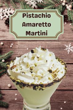 pistachio amarretto martini in a glass with whipped cream on top