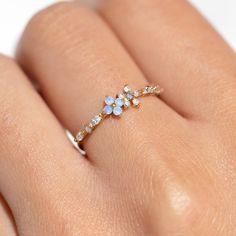 Take beauty wherever you go in the Blue Blossom Garden Ring. This design has become a GC favorite and is here to stay! You'll get lost in the stunning and calming baby blue and milky white cubic zirconia stones. Beautiful Earth Boutique, Cute Rings For Teens, Cute Aesthetic Jewelry, Cute Engagement Ring, Pretty Rings Simple, Light Blue Jewelry, Forget Me Not Ring, Rings Everyday, Garden Ring