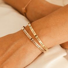 ❤️ Grab 3 fabulous items and enjoy a delightful 25% off when you use the code BUY3GET25 Elevate your style and touch loved one's heart with our Personalized Bangle Bracelets.  Engraved with a custom name or inspirational message, these gold plated bracelets make a perfect gift for your loved one. Express your love and admiration in a unique and elegant way with our meaningful and personalized bracelets. #YOU MAY ALSO LIKE Personalized Bracelet https://www.etsy.com/listing/527644356/personalized- Gold Bracelets For Friendship On Mother's Day, Elegant Bangle Bracelet For Best Friend Gift, Inspirational Stackable Jewelry As Gift, Inspirational Stackable Jewelry As A Gift, Rose Gold Stackable Bangle As Gift, Adjustable Engraved Bracelet As A Gift For Her, Stackable Rose Gold Cuff Bracelet As Gift, Stackable Rose Gold Cuff Bracelet For Gifts, Inspirational Bangle Jewelry For Best Friend Gift