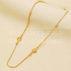 Adorn yourself with this elegant gold necklace, featuring a delicate chain and a stunning, handcrafted pendant. Its versatile design makes it a perfect accessory for both casual and formal looks, adding a subtle touch of glamour to your ensemble. yellow gold handmade chain jewelry from India. Brand- StarLikesGoldIndia Metal- yellow gold real gold. Metal purity- 18 Karat. Weight- 8.69 grams approx. Length - 18 inches approx Width-  1 and 8 millimeter, approx. Condition- excellent brand new Please Gold Necklaces With Elegant Pendant Design, Gold Chain Necklace With Simple Design For Gift, Elegant Gold-plated Gold Necklace, Gold Necklace With Simple Round Design, Simple Gold Necklace With Round Pendant, Simple Gold Necklace With Round Shape, Delicate Yellow Gold Chain Necklace With Round Pendant, Simple Gold Round Necklace, Elegant Round Pendant Necklace In Yellow Gold