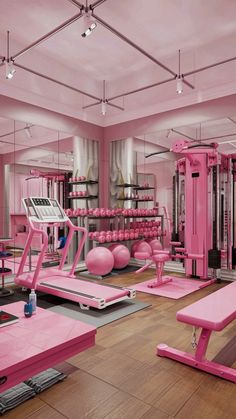 a pink gym room with exercise equipment in it