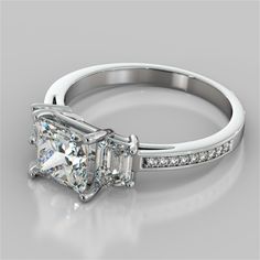 an engagement ring with a princess cut diamond and channel set diamonds on the side, in white gold