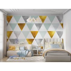 a bedroom decorated in gold and white with geometric wallpaper