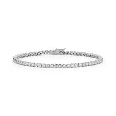 Our version of the classic diamond tennis bracelet, the Lulu Jack Bezel Tennis Bracelet dazzles with more than a quarter-carat of bezel-set round white diamonds going halfway around the bracelet. Perfect for everyday wear, this instant classic will look stunning with everything. The Lulu Jack Bezel Tennis Bracelet has slightly wider bezels than the Lulu Jack Single Row Bezel Bracelet. We suggest the Lulu Jack Single Row Bezel Bracelet if you're looking for a full eternity diamond tennis bracelet Dana Rebecca Designs, Bezel Bracelet, Kids Bracelets, Diamond Tennis Bracelet, Bridal Engagement Rings, Buddha Pendant, Solitaire Studs, Climber Earrings, White Gold Bracelet