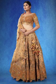 A beautiful rust-colored organza ensemble, adorned with intricate sequin threadwork, stonework, and cutdana. The exquisite craftsmanship is highlighted by the rich, textured fabric, making it a piece that stands out. WASH CARE INSTRUCTIONS - Please Dry clean only when it is applicable! Ready to Ship! Unstitched Hand Embellished Lehenga In Organza, Traditional Hand Embellished Chanderi Sharara, Embellished Tissue Silk Saree Set, Hand Embellished Anarkali In Chanderi, Hand Embellished Chanderi Sharara For Wedding, Hand Embellished Chanderi Anarkali Traditional Wear, Elegant Embellished Chanderi Lehenga, Fitted Hand Embellished Organza Lehenga, Hand Embellished Fitted Organza Lehenga