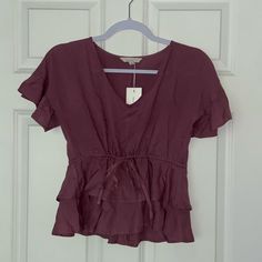 Mauve Peplum Blouse With Adjustable Waist. New With Tag Purple V-neck Top For Summer, Lavender V-neck Summer Blouse, Chic Mauve Blouse For Summer, Purple Summer Blouse For Day Out, Chic Mauve Tops For Day Out, Summer Purple Blouse For Day Out, Chic Purple Short Sleeve Tops, Casual Mauve Summer Blouse, Casual Mauve Blouse For Summer