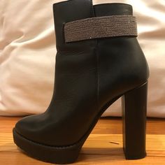 Almost Brand New! Worn 3 Times. Step Out In Style With This Authentic Pair Of Brunello Cucinelli Calfskin Monili-Strap Ankle Boot Size 36.5 Crafted From Supple Black Calfskin Leather With An Almond Toe. Featuring An Adjustable Ankle Strap With Monili Beading, A Side Zip Closure And A Self-Covered Chunky Block Heel. Black Leather Chunky Heel, 4.5'' Platform, 1'' Adjustable Beaded Strap Leather Lining And Rubber Sole Elegant Embellished Ankle-high Heels, Elegant Embellished Ankle Boot Heels, Formal Embellished Ankle Boots, Embellished Heels For Formal Occasions In Fall, Embellished Formal Heels For Fall, Elegant Heeled Ankle Boots With Strap, Formal Ankle Boots With Heel Strap, Elegant Evening Boots With Buckle Closure, Chic Embellished Evening Boots