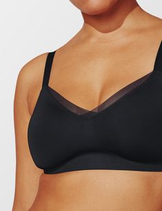 Sculpting support that comfortably reduces your bust up to 2 inches. Breathable, soft, and looks cute, too. Minimizing compression, no foam cups Wirefree 'lift zones' boost & support Disappears under clothes with lightweight, seamless design No spillage - all-over secure coverage Wear 2 ways - adjustable straps convert to x-back True to size; for best fit, order your normal bra size Best for D cups & up Full coverage Nylon/Spandex blend Hand wash in cold, lay flat to dry Use a lingerie bag for m Supportive Black Seamless Nursing Bra, Supportive Black Nursing Bra With Medium Bust Support, Black Nursing Bra With Medium Bust Support, Supportive Black Nursing Bra With Removable Pads, Black No-show Nursing Bra, Black Nursing Bra With Full Coverage And Light Support, Black Full Coverage Nursing Bra With Light Support, Supportive Black Bra With Removable Pads, Compressive Black Bra With Removable Pads