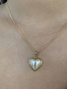 "18 Karat Gold Filled Pearl Heart Charm Necklace The perfect addition to layering with other 14\" or 16\" inch dainty gold chains. An elegant, simple piece that transitions well for daily wear. Material: 18 Karat Gold Filled, Hypoallergenic, Tarnish Resistant. Pendant Size: 17mm x 18mm (without bail) Chain Length: 18 inches Proper Care for your new MaLiBeads: Gold Filled products are durable; however, please remember to apply beauty products such as perfume, hairspray or deodorant before wearing Pearl Heart Pendant Necklace With Clavicle Chain, Heart Pendant Pearl Necklace With Clavicle Chain, Pearl Heart Necklace With Clavicle Chain, Delicate Pearl Necklace With Heart Charm And Pendant, Gold Heart Necklace With Pearl Pendant For Valentine's Day, Dainty Heart Necklace With Pearl Chain For Valentine's Day, Valentine's Day Gold Heart Necklace With Pearl Pendant, Heart-shaped Pearl Necklace With Charm, Gold Pearl Necklace With Heart Charm And Pendant