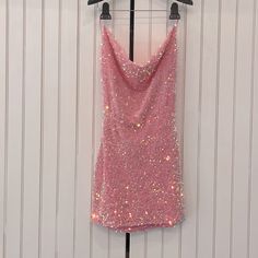 This Dress Is A Cute Mini Dress Perfect For A Homecoming, New Years, Sweet Sixteen Or Any Event. It’s Sequined And Is A Beautiful Strawberry Pink. There Is A Light Weight Lining Built In And The Neck Is Cowl. The Back Is Really Beautiful And Is Open With A Few Straps That You Can Tie To Your Fit. This Dress Is Brand New And Has Never Been Worn. It Is A Size Medium But It Is Adjustable! Pink Tassel Dress, Pink Sweet Sixteen, Pink Sparkle Dress, Homecoming Inspo, Lucy In The Sky Dress, Rose Body, Pink Sequin Dress, Cute Mini Dress, Cute Homecoming Dresses